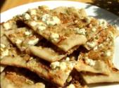 Pumpkin Seed Flatbread Topped With Sweet Onions And Feta